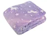 A folded blanket with a unicorn and star pattern. Anteprima dell’immagine prodotto