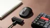 A desk setup with a notebook, mouse, and keyboard. Produktbild-Vorschau