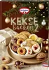 A festive arrangement of Christmas cookies and a gift box, with a decorated Christmas tree in the background. Produktbild-Vorschau