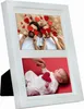 A white multi-photo frame displaying two photos, one of a couple holding heart shapes and another of a baby with a heart. Náhled obrázku produktu