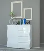 A white high-gloss sideboard with wavy sides, decorated with books, picture frames, and a vase with greenery. Voir les images du produit