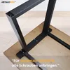 Close-up of black metal table legs being attached to a wooden tabletop with screws. Anteprima dell’immagine prodotto