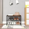 A shoe rack filled with shoes in an entryway, with a handbag and a decorative camera on top. Produktbild-Vorschau