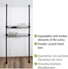 A black metal shelving unit with two wire baskets, mounted between the floor and ceiling. Náhled obrázku produktu
