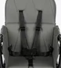 A close-up view of a gray baby high chair's harness system. Podgląd zdjęcia produktu