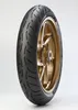 A motorcycle tire mounted on a gold rim, presented against a white background. Náhled obrázku produktu