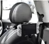 A Nintendo Switch is mounted on the back of a car seat headrest. Produktbild-Vorschau