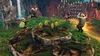 Four people are running and jumping on a rocky, jungle-like terrain with waterfalls and tribal-style structures in the background. Golden rings are floating in the air. Produktbild-Vorschau