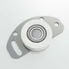 A close-up studio shot of a sliding door roller assembly on a white background. Produktbild-Vorschau