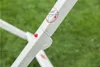 Close-up of a white drying rack with a red button and a warning symbol. Náhled obrázku produktu