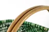 Close-up of the handle and woven material of a basket. Náhled obrázku produktu