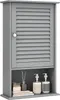A gray bathroom wall cabinet with a louvered door and an open shelf below, displaying toiletries and decorative items. Podgląd zdjęcia produktu