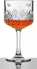 A crystal cocktail glass filled with amber liquid, set against a white background with a reflection on a gray surface. Náhled obrázku produktu