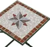 A close-up view of a mosaic tabletop with a compass rose design. Produktbild-Vorschau