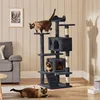 Three cats interact with a multi-level cat tree in a living room setting. Produktbild-Vorschau