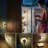 A collage of images showing a dimmable LED night light plugged into various outlets, with one image showing a woman taking a bottle of water from a refrigerator at night. Produktbild-Vorschau