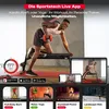 A man is performing a dumbbell row exercise on a bench, with a tablet and phone displaying workout videos in the foreground. Below are smaller images of different workout programs. Produktbild-Vorschau