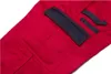 A close-up view of red work pants with black accents and pockets. Produktbild-Vorschau