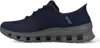 A side view of a navy blue Skechers slip-on shoe with a gray sole. Voir les images du produit