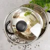 A glass lid with a stainless steel rim is placed over a pot containing noodles and bay leaves, with peppercorns scattered around the pot. Náhľad obrázku produktu