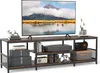 A TV stand with a television and various electronic devices and decorative items. Náhľad obrázku produktu