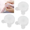 A collage showing a close-up of hands using a duvet clip on bedding and three individual duvet clips. Voir les images du produit