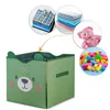 A green storage bin with a bear face is shown, with smaller circular images around it displaying folded clothes, towels, a teddy bear, and building blocks, suggesting items that can be stored in the bin. Náhled obrázku produktu