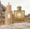 Two bottles of Burberry Goddess perfume are displayed on rocks with a blurred natural background. Náhled obrázku produktu
