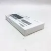 A white product box with text and a barcode, placed on a textured white surface. Produktbild-Vorschau