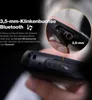 A close-up of a rugged mobile phone showing its ports and buttons, with a magnified inset of the 3.5mm audio jack. Podgląd zdjęcia produktu