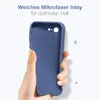 A hand holding a blue phone case against a white background. Produktbild-Vorschau