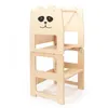 A wooden learning tower for children, designed to resemble a panda face. Anteprima dell’immagine prodotto