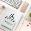 A flat lay of office and craft supplies on a pink background. Produktbild-Vorschau