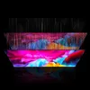 A layered, abstract representation of a screen displaying vibrant colors and light effects, set against a black background. Anteprima dell’immagine prodotto
