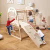 Children playing on a wooden indoor climbing frame in a room. Produktbild-Vorschau