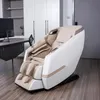 A massage chair is placed in a modern office or living space, next to a desk with a computer monitor. Produktbild-Vorschau
