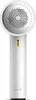A white electric lint remover and fabric shaver with a gray mesh head and a yellow indicator light. Produktbild-Vorschau