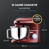 A red kitchen mixer with a silver bowl is shown against a black background, with dimensions and warranty information displayed. Produktbild-Vorschau
