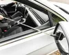 A person is using a telescopic side mirror wiper inside a car. Anteprima dell’immagine prodotto