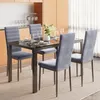 A dining set with four chairs and a table in a modern dining room setting. Náhľad obrázku produktu