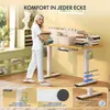 A woman is carrying books towards a height-adjustable desk, with various product features highlighted in smaller inset images. Produktbild-Vorschau