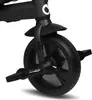 A close-up of the front wheel and pedals of a black tricycle. Produktbild-Vorschau
