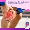 A person holding their knee, with a product bottle in the foreground and text overlay. Produktbild-Vorschau