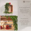 A collage of images showing wooden crates used for decoration, with plants, flowers, and candles. Produktbild-Vorschau