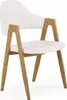 A white upholstered chair with wooden legs and armrests, shown against a white background. Podgląd zdjęcia produktu