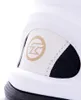 A close-up of the side of a white inline skate, showing a gold logo on a white patch. Podgląd zdjęcia produktu