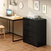 A modern home office setup with a desk, a black four-drawer dresser, and artwork on the wall. Náhled obrázku produktu