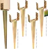 A set of four metal ground anchors with a wooden post on one of them, and screws scattered around. Náhled obrázku produktu