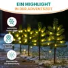 Mini Christmas trees with warm white LED lights in a snowy outdoor setting. Produktbild-Vorschau