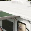 A close-up view of an RV awning extended over a window. Anteprima dell’immagine prodotto